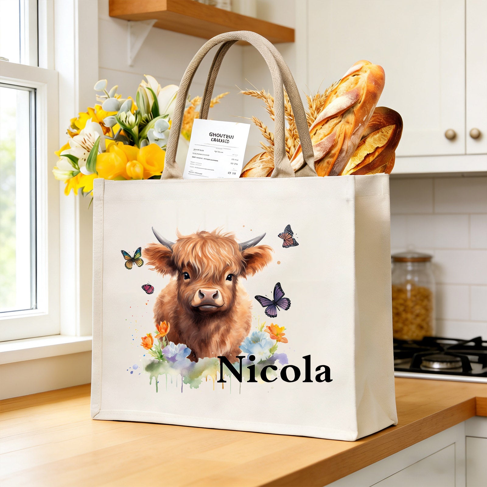 Personalized highland cow tote bag filled with daily essentials on kitchen counter, large capacity for groceries and errands