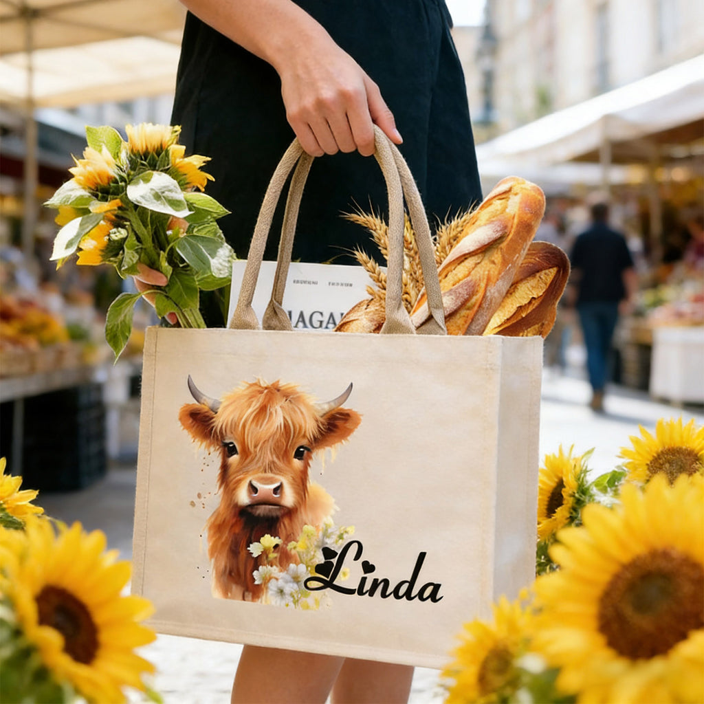 Woman carrying custom highland cow tote bag outdoors, cute and practical for daily outings
